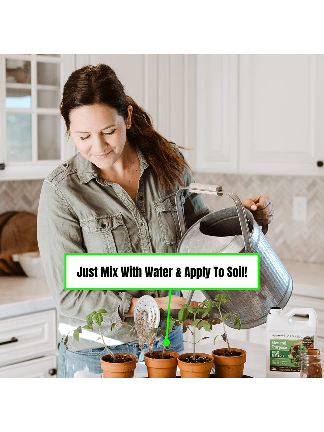 Woman Watering Plants with AgroThrive Organic 3-3-2 General Purpose Liquid Fertilizer