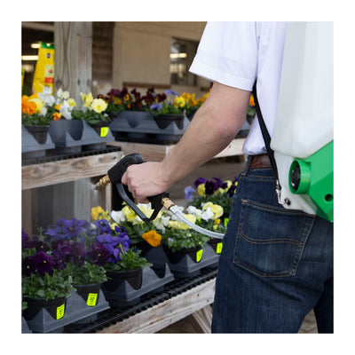 Gardener Using FlowZone Cyclone 2.5V Battery Operated Variable Pressure Sprayer