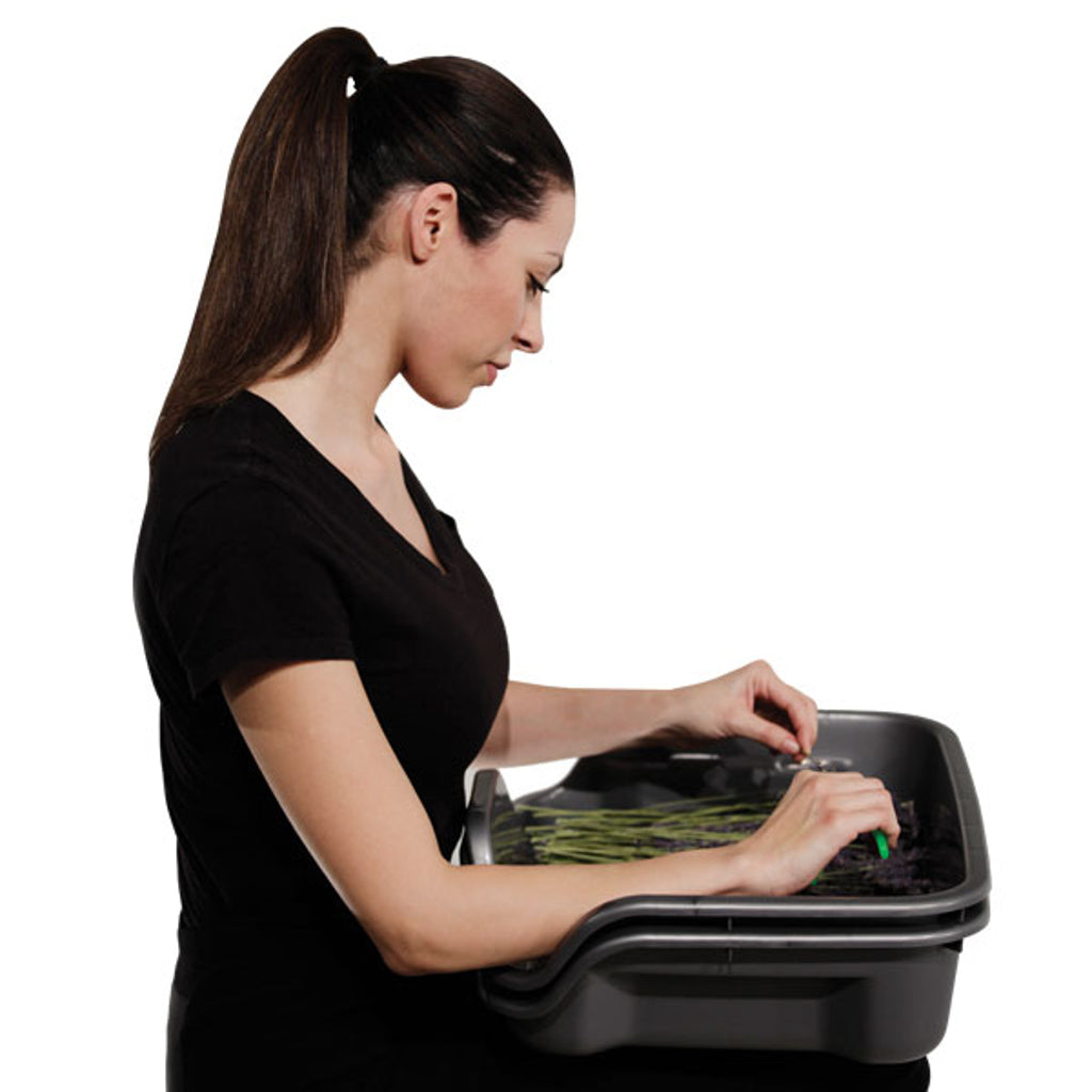 Woman Using Harvest More Trim Bin